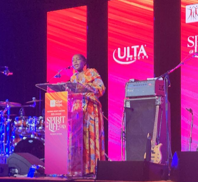 Koko speaking on stage
